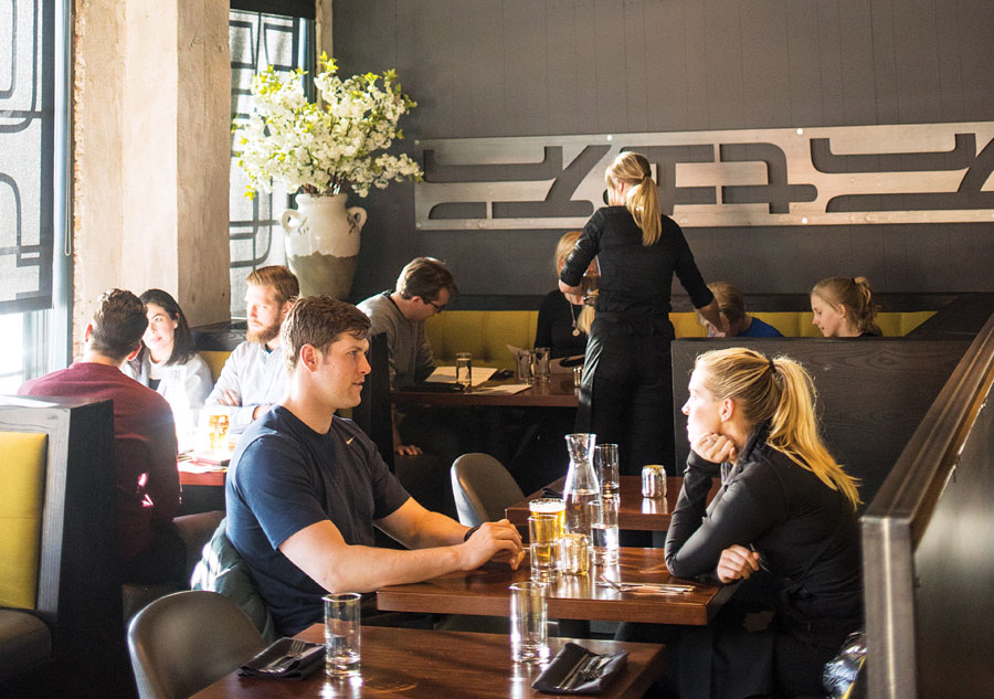 People eating in the dining room at Jun in the North Loop in Minneapolis, Minnesota.