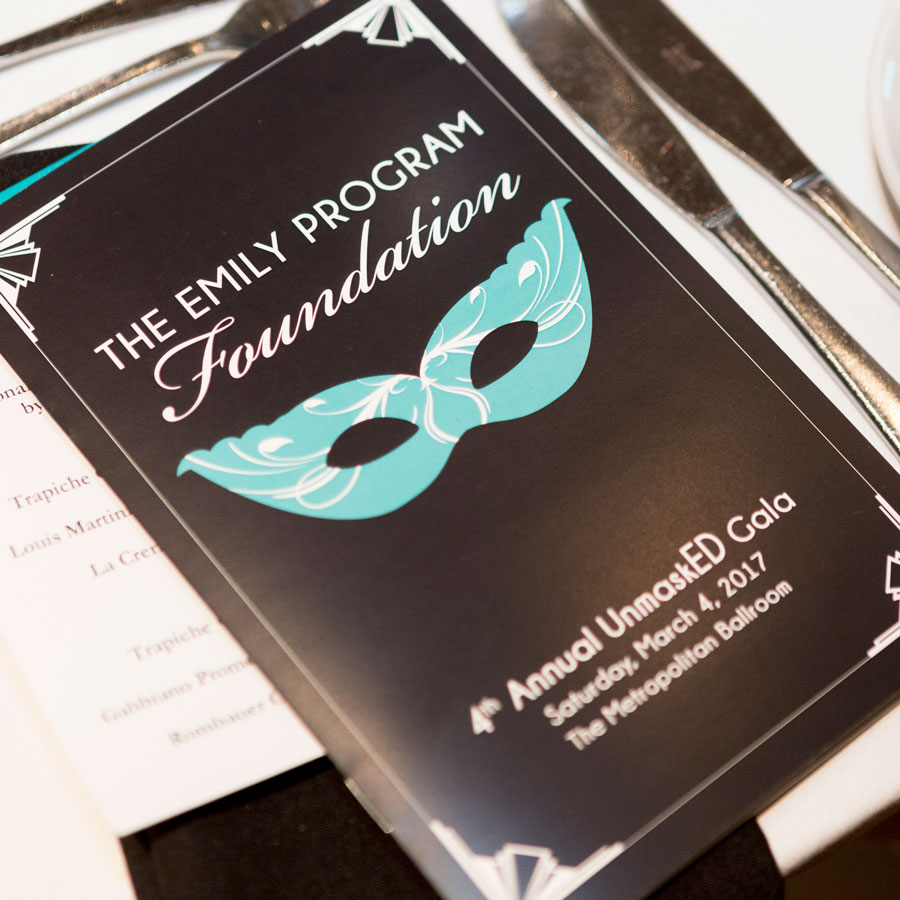 A brochure for the Emily Program's UnmaskED Gala.