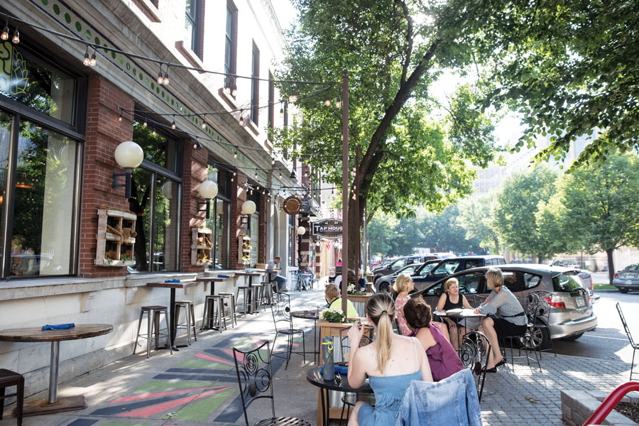 People dining on the sidewalks of Rochester, Minnesota's historic third street.