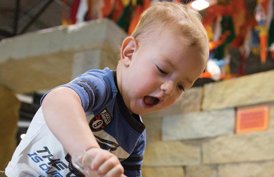 A young boy playing at the Childrens Museum of Southern Minnesota.