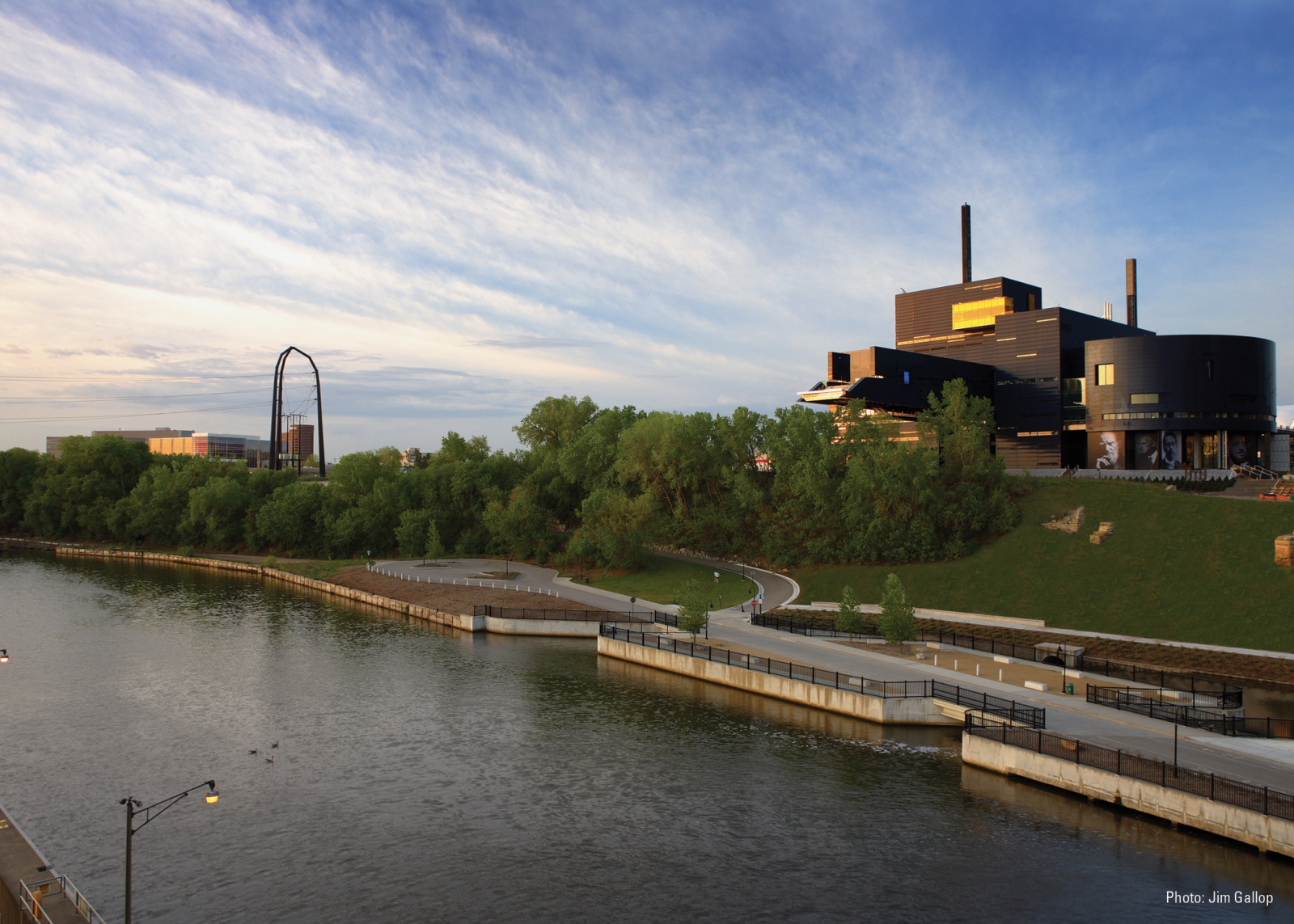 By Gallop Studios, courtesy Guthrie Theater. The Guthrie Theater on the Mississippi Riverbank at sunset.