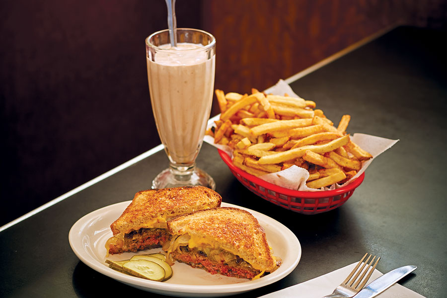 A patty melt, basket of fries, and chocolate shake at Convention Grill.
