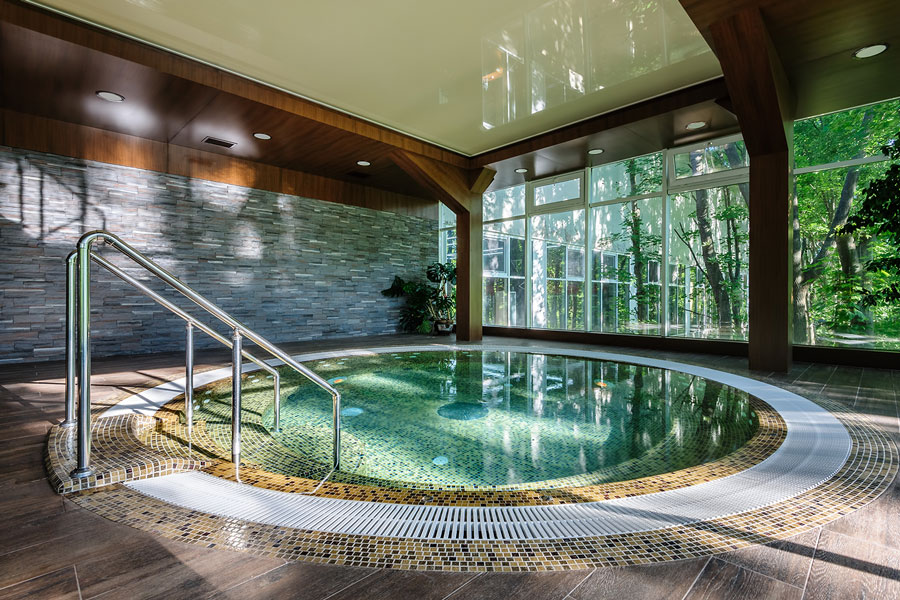 A large hot tub inside a spa.