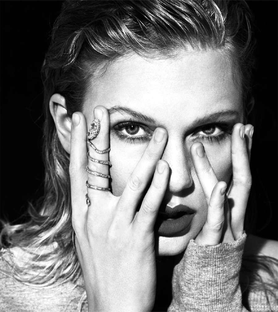 A black and white portrait of Taylor Swift.