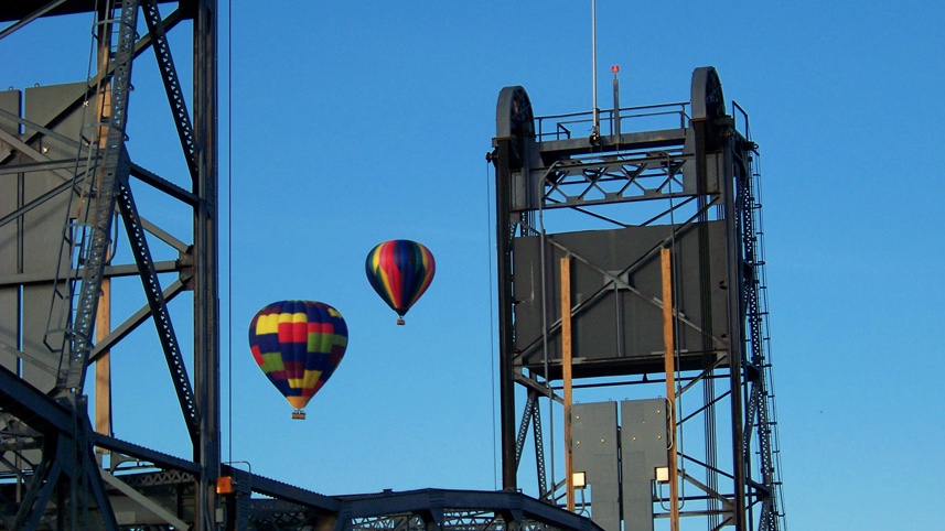 Two hot air balloons over the Stillwater Lift Bridge. Courtesy Aamodt's Balloons.