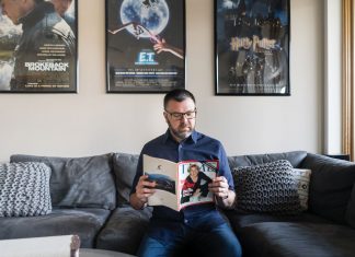 Jason Matheson catching up on a few of his favorite subjects at his North Loop condo