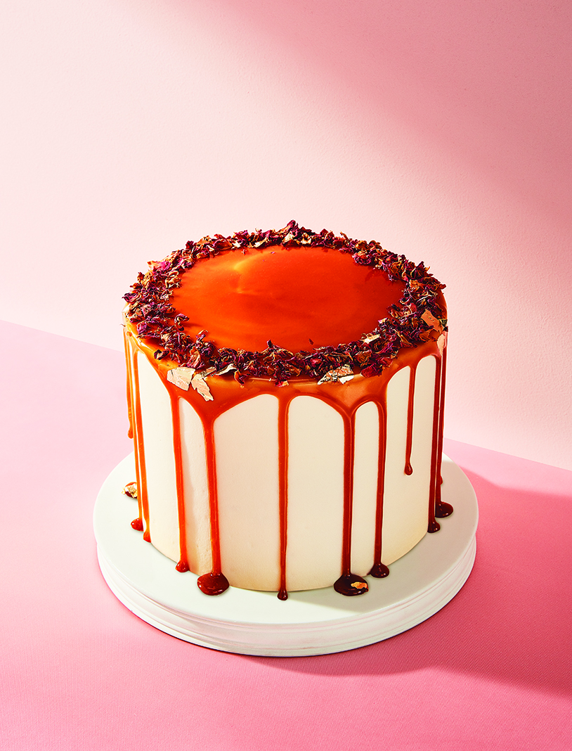 The Copper Hen's Signature Carrot Cake, topped with cream cheese frosting, perfect caramel drip, edible dried rose petals, and gold flakes, is one of the best desserts in the Twin Cities (and the star of our March/April cover)