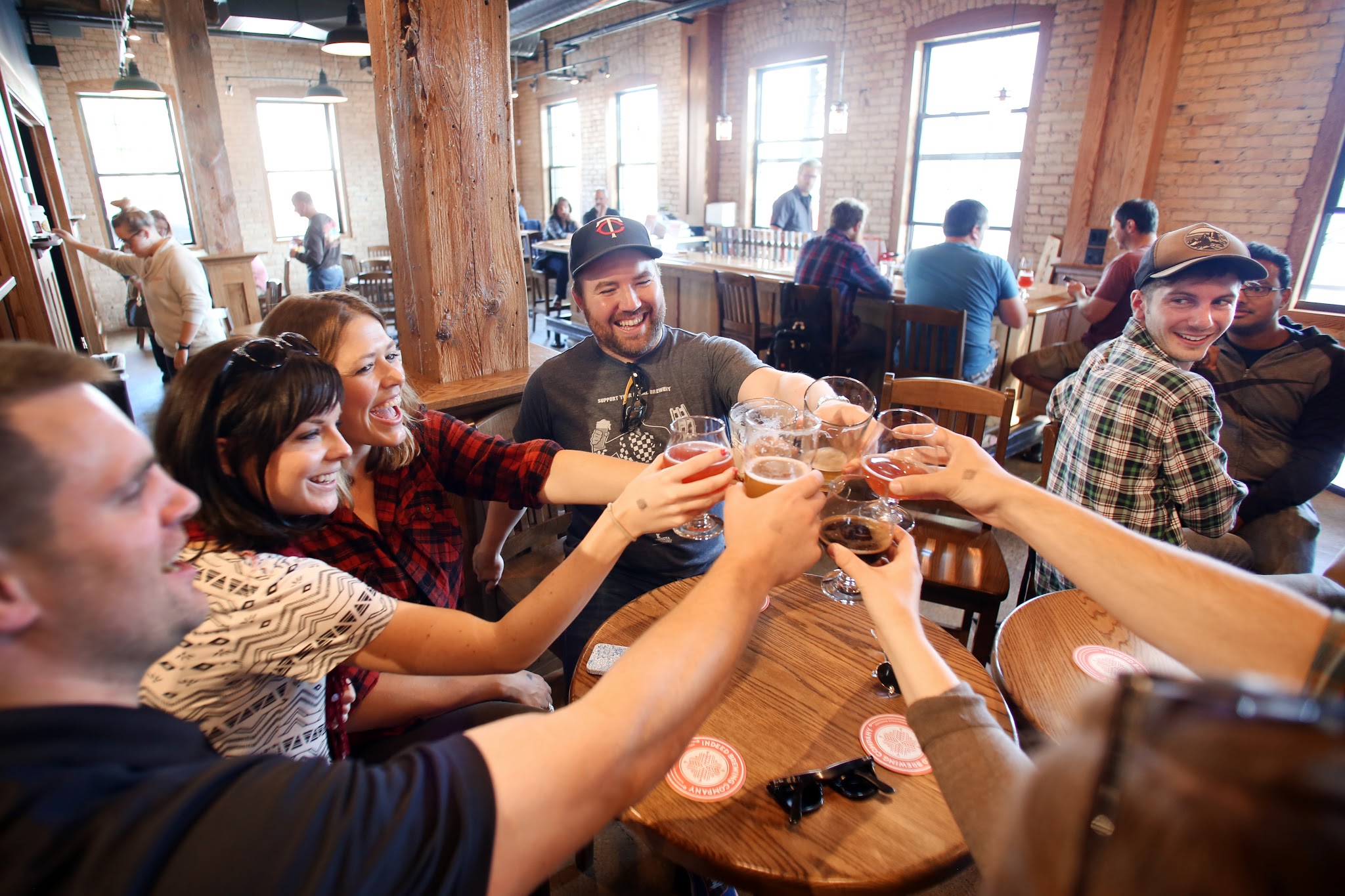 Friends enjoying a beer at Indeed Brewing Co., one of many Minnesota breweries