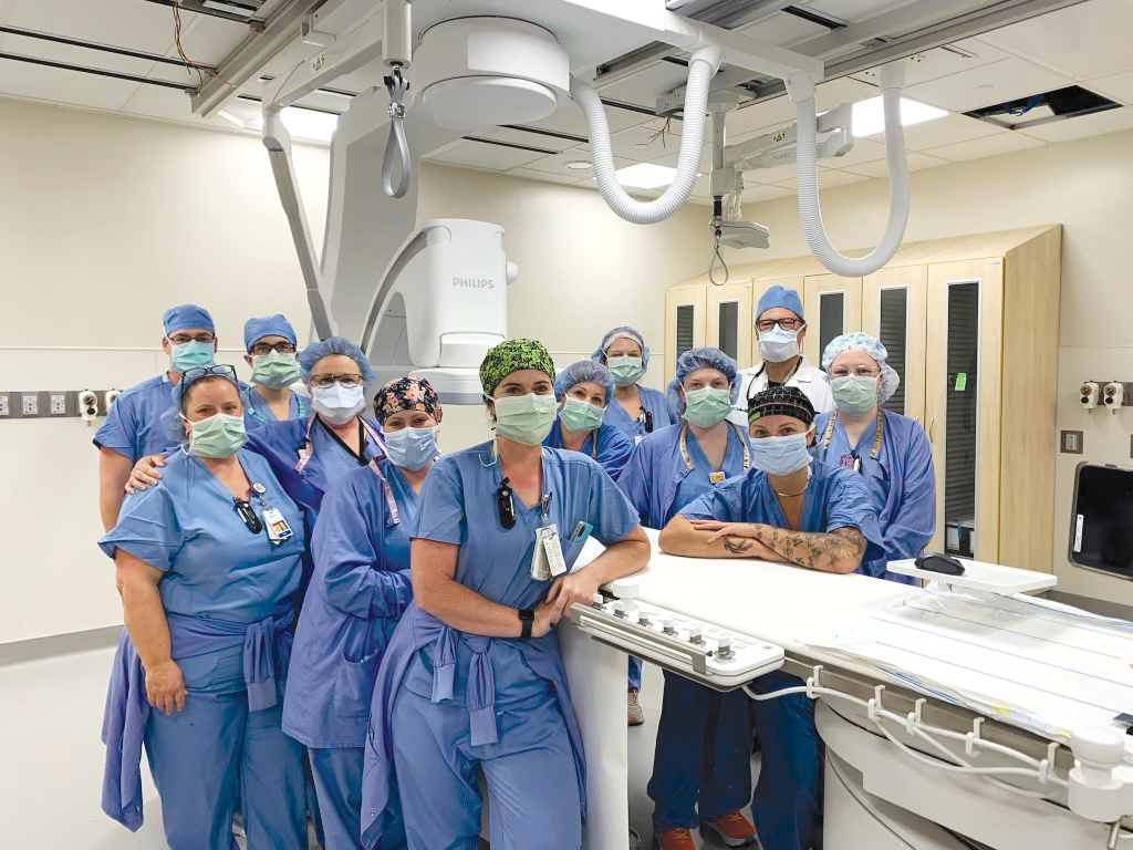St. John's staff next to state-of-the-art heart care technology | M Health Fairview