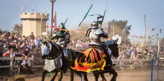 Two knights jousting on horseback