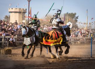 Two knights jousting on horseback