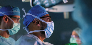 Transformative Care for Chronic Kidney Disease surgeon peering through scope