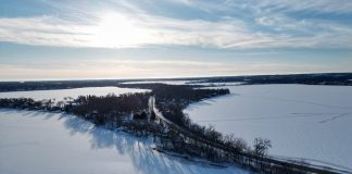aerial shot of iced over lake