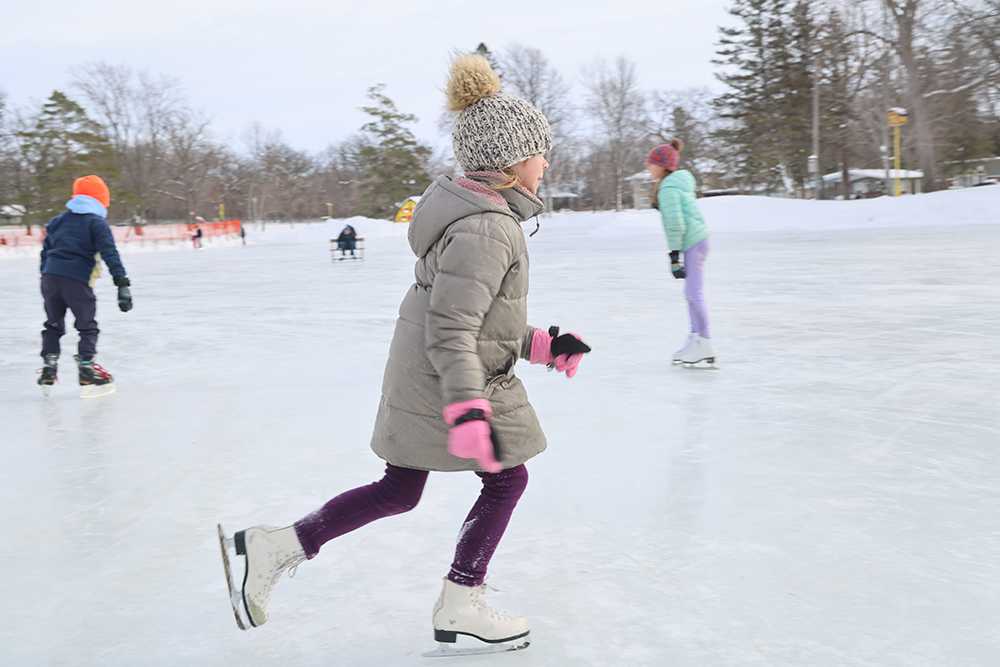 girl skating on a lake