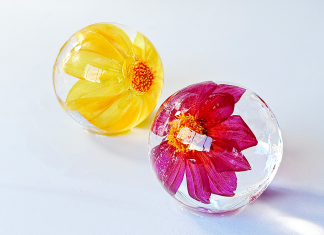 yellow and pink flowers in ice sphere cube