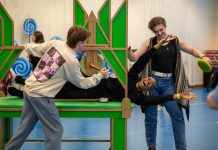Regina Marie Williams, as the Tin Man, rehearses with the cast of CTC's "The Wizard of Oz"