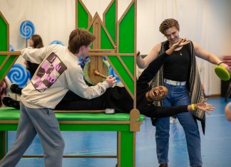Regina Marie Williams, as the Tin Man, rehearses with the cast of CTC's "The Wizard of Oz"