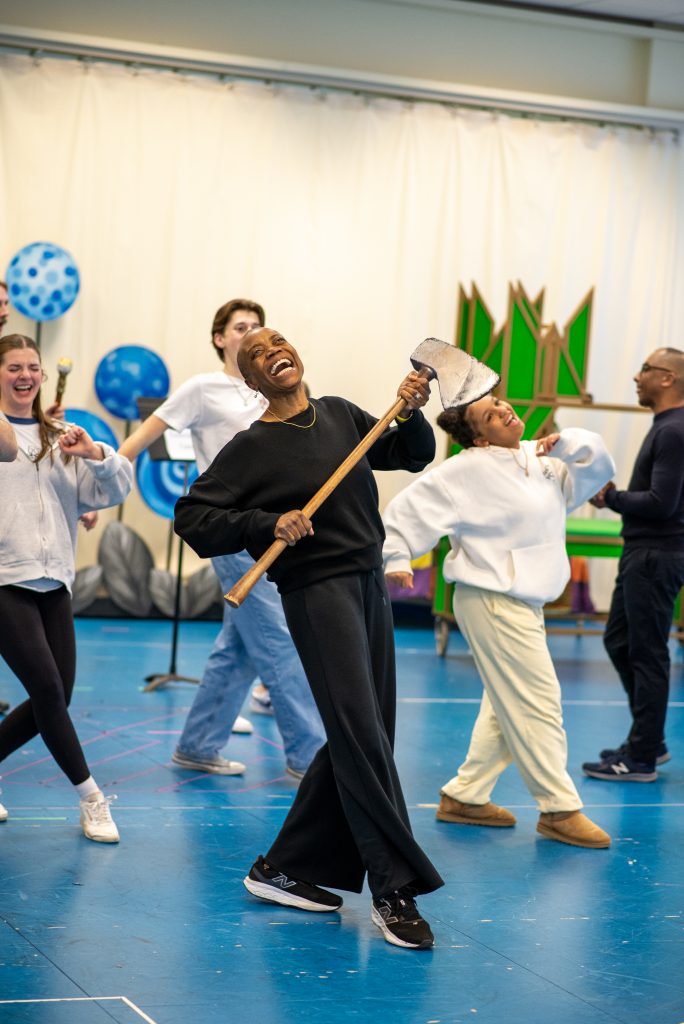 Regina Marie Williams, as the Tin Man, rehearses with the cast of CTC's "The Wizard of Oz"
